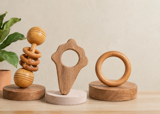 Three wooden baby toys or rattles made of neem wood, very safe for children to use.