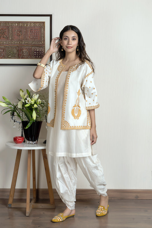 Chanderi sleeveless short kurta paired with embroidered jacket and dhoti pants