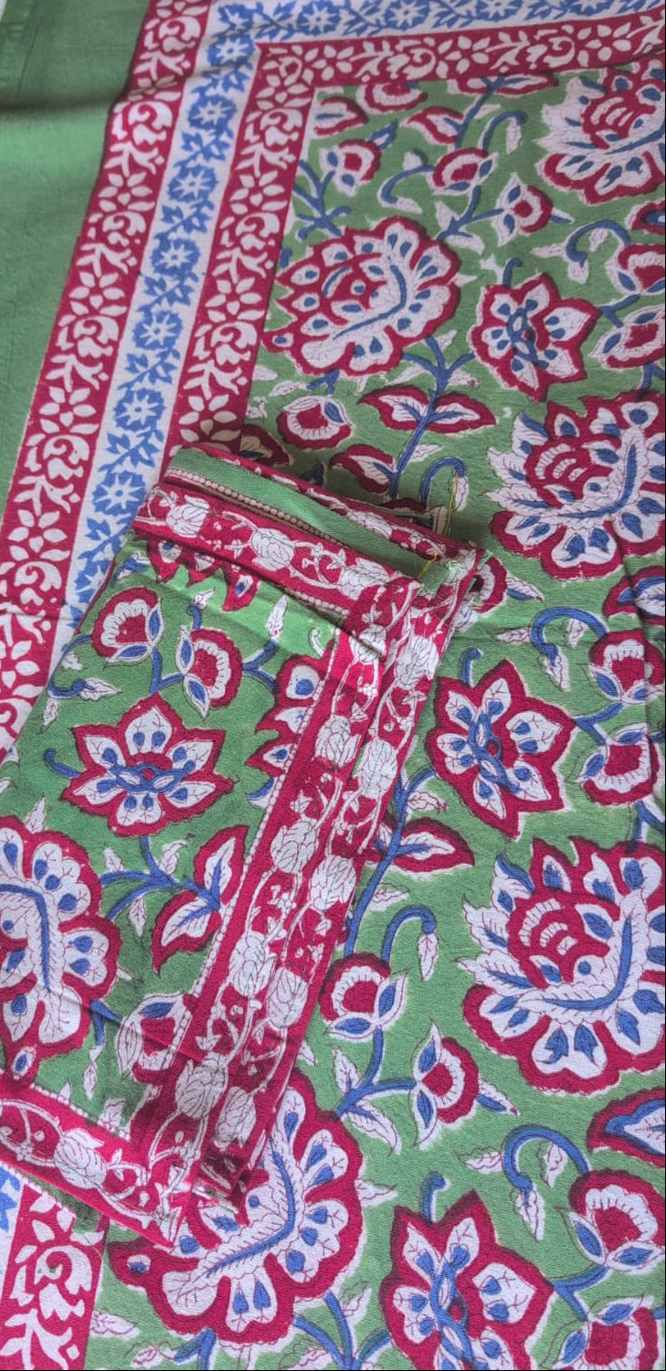 Green floral table runner from Jaipur. Hand made with block prints in bright colours. 