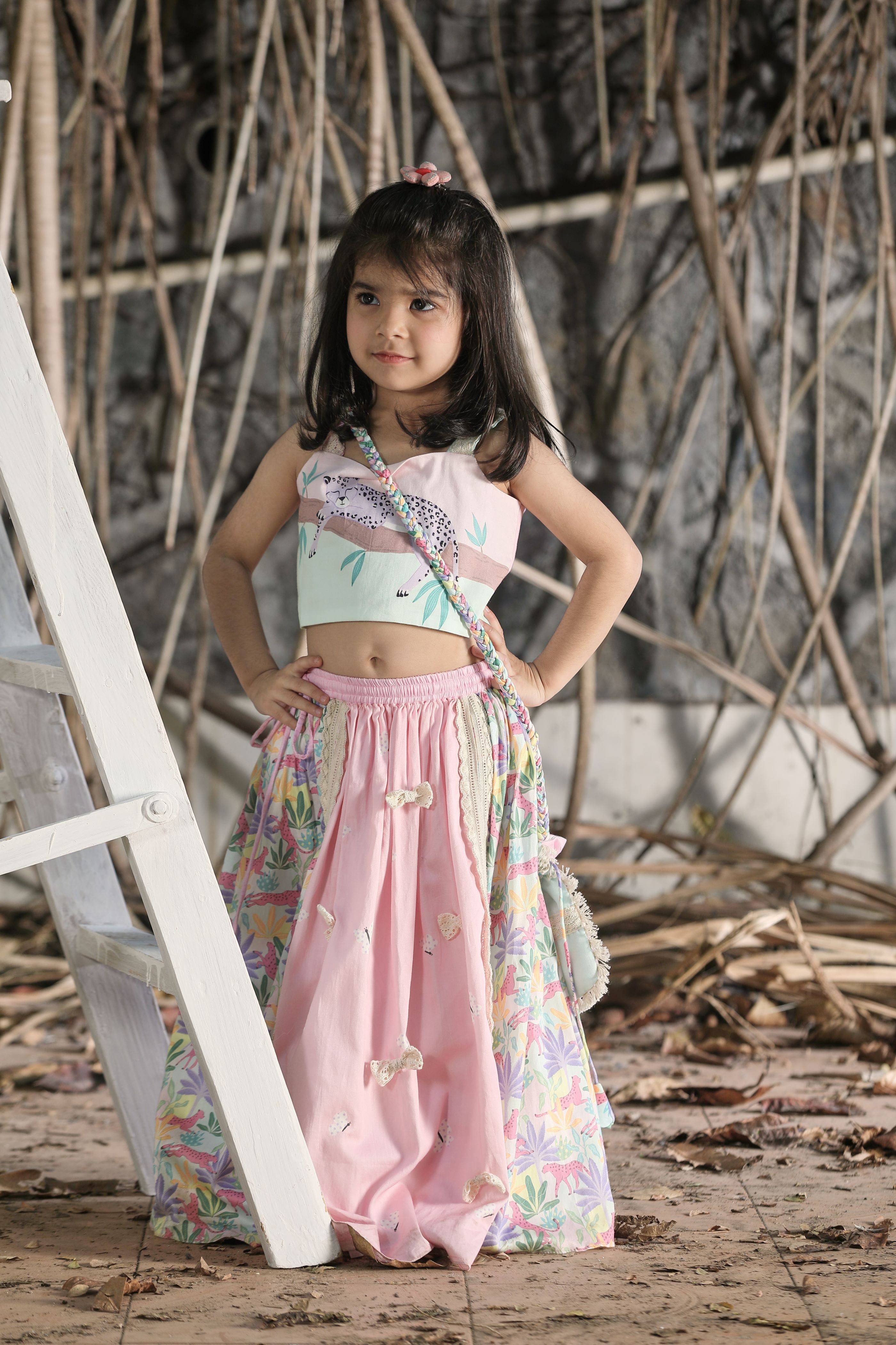 Pink and tropical print lehengas, strappy blouse, potli bag set