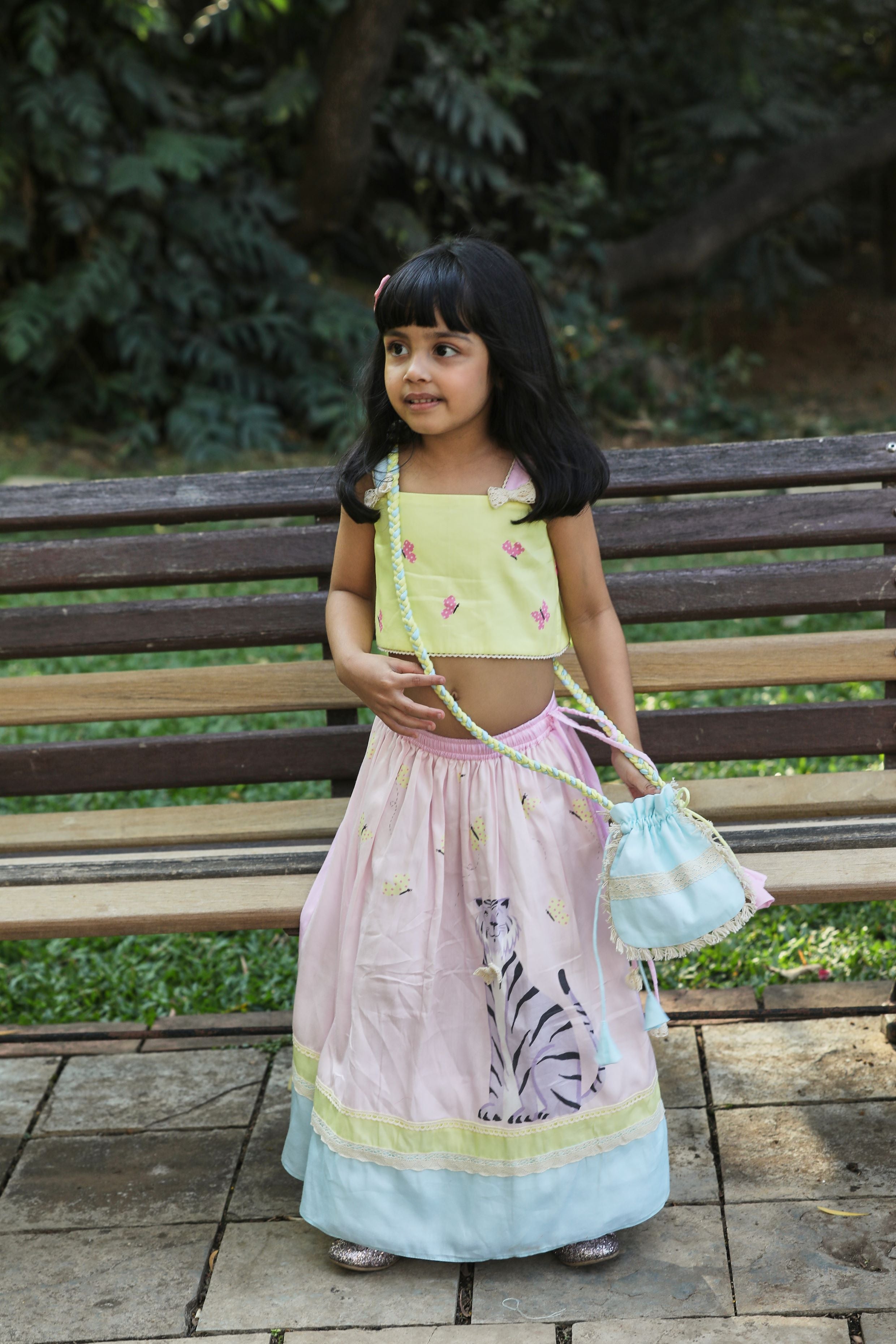 Pink lehenga, yellow butterfly print strappy blouse, Potli bag set